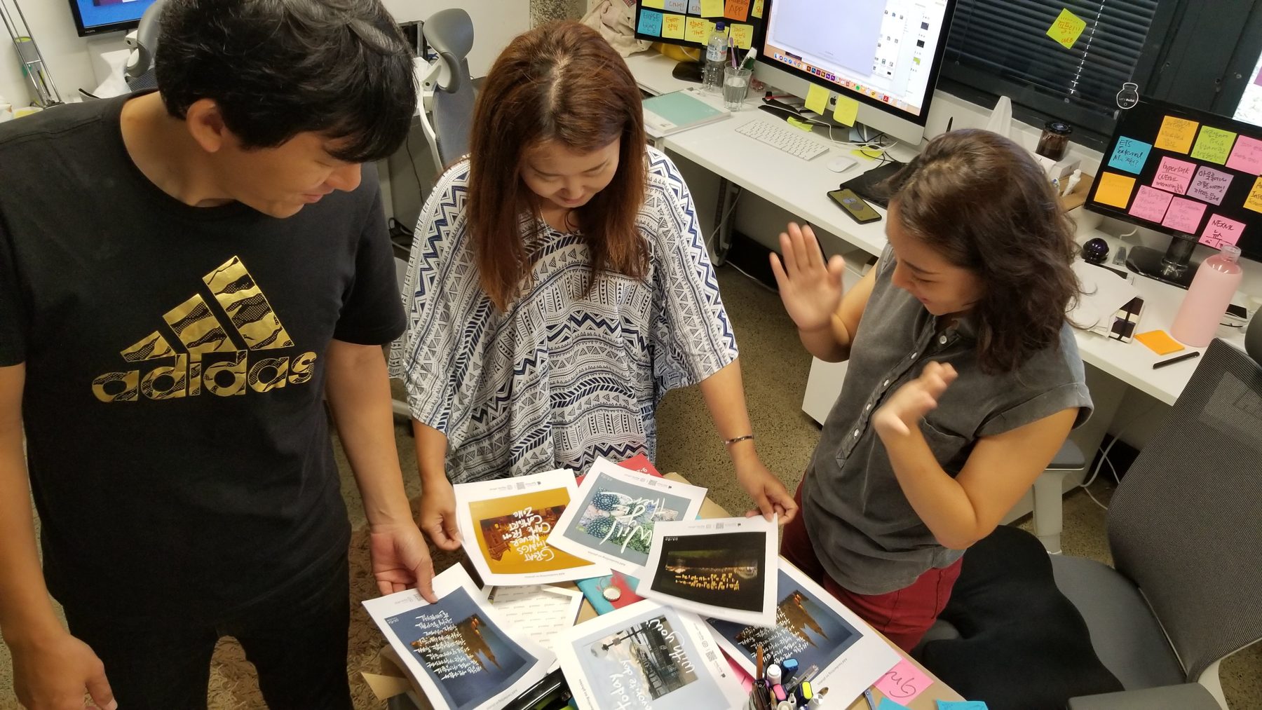 Team reviewing printed GRIDA cards