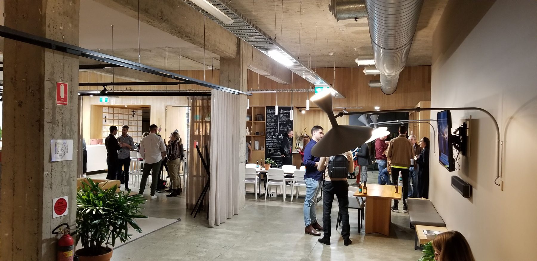 Open-plan studio interior with concrete columns